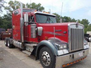 Red semi truck after custom refinishing