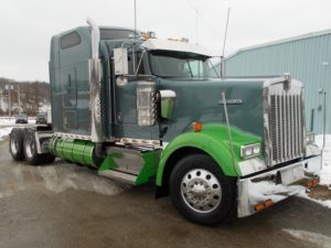Green semi truck after custom refinishing