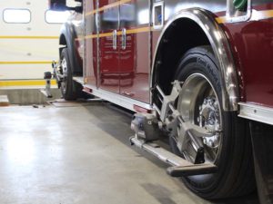 Ambulance getting wheel alignment in Truckstar body shop
